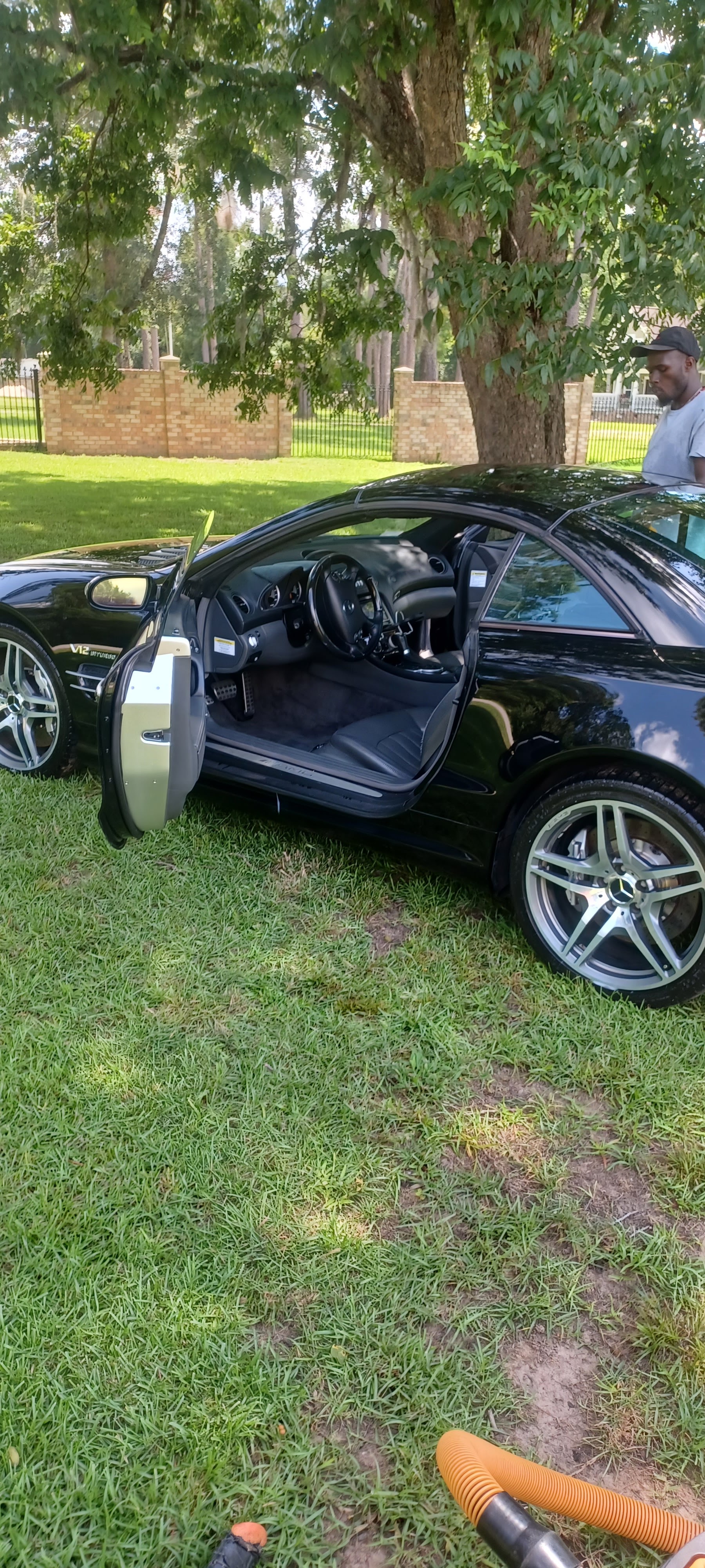 Black Mercedes coupe with the door open, interior detailed