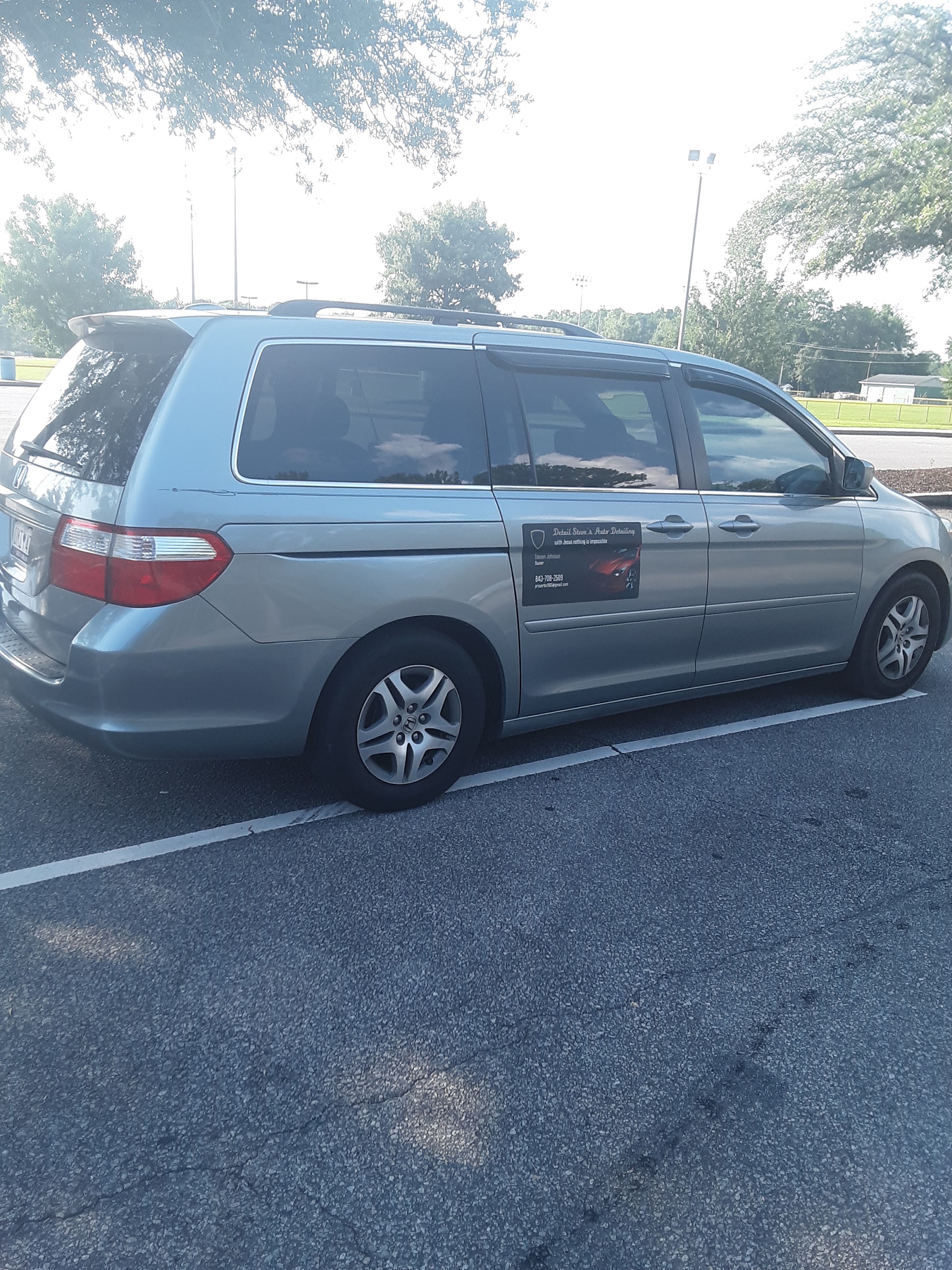 My minivan with the Detail Steve's Auto Detailing sign on the door